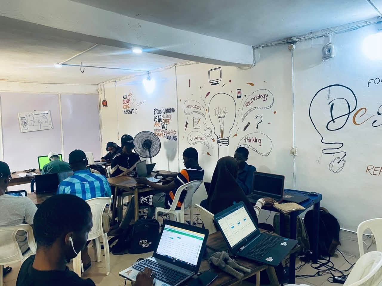 Students working on laptops in the GigsTech classroom